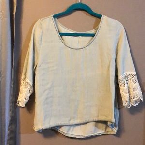 Cute blue top with lace ends